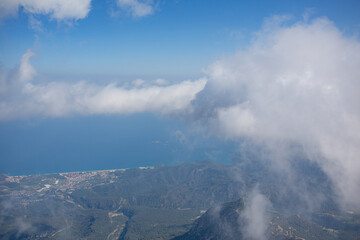 Fototapeta premium Mediterranean sea and cost view from the mountain summit through clouds