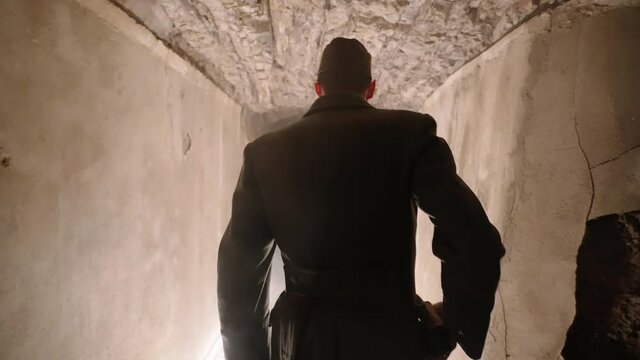 Austro-Hungarian army officer walk through underground tunnel 4K. Filmed with the cooperation of Kulturno zgodovinsko Drustvo Triglav from Slovenia 