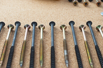 Repair. Self-tapping screws on the desktop. The concept of a repair shop.