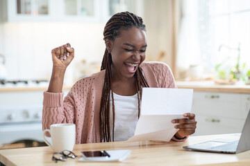 Good News. Portrait Of Overjoyed African American Lady Reading Letter In Kitchen