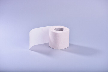 roll of toilet paper on a blue background.