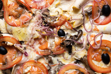 Delicious juicy pizza close-up. View from above.
