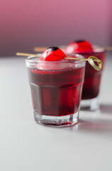 Scary drinks shots made with tequila, grenadine and tabasco decorated with jelly eyeball