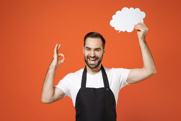 Young man barista bartender barman employee in apron white tshirt work in coffee shop blank Say...