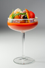 Bloody Mary with interesting decoration with a small snack on top of a cocktail glass
