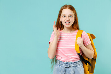 Little excited shocked pupil redhead kid girl 12-13 year old in pink striped t-shirt yellow school...