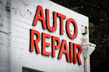 Auto repair sign on building