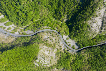 vertical aerial view of the road that crosses the apuan alps in tuscany