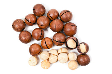 Macadamia nuts heap isolated on a white background. Top view.
