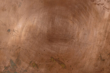 Aged copper background with oxidation stains and traces of polishing. Copy space. 