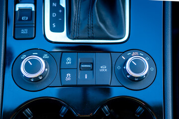 Air suspension control module inside german car. Normal mode, lock mode, auta start/sop © RoClickMag