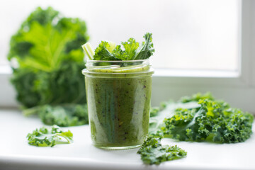 Green detox cocktail with cale salad, vegetarian healthy smoothie in a jar
