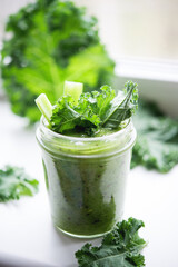 Green detox cocktail with cale salad, vegetarian healthy smoothie in a jar, selective focus