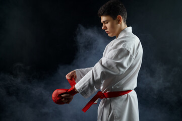 Male karate fighter having red belt and gloves © Nomad_Soul