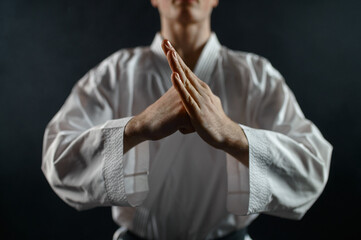 Male karate fighter in white kimono, welcome sign © Nomad_Soul
