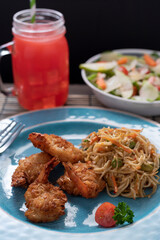 Crab cake with pasta and salad