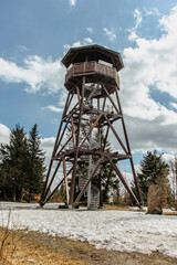 Wooden observation tower called Anna on Anensky Peak in Orlicke Mountains,Czech Republic.Spiral staircase of lookout tower, construction with metal steps and oak platform.Czech tourist place
