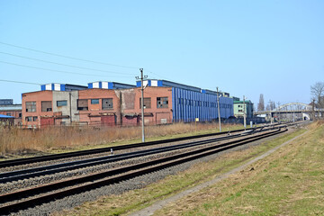 Fototapeta na wymiar Railway tracks and production shops of Kaliningrad Carriage Works