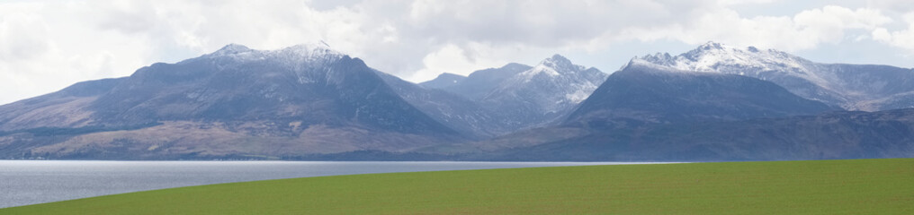 Arran viewed from Rothesay in Isle of Bute under dark clouds