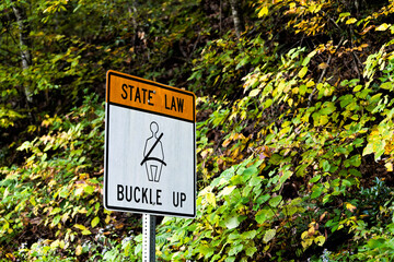 Virginia state law buckle up sign for car seat belt text sign on road in mountain Highland county,...