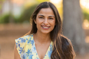 Outdoor headshots of beautiful Asian Indian woman. 