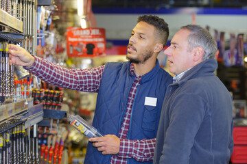 hardwarer store seller with client