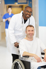man in his wheelchair with a male nurse