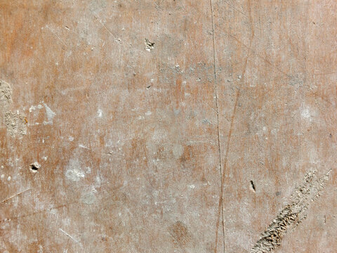 old stained and scratched pale brown wooden board background