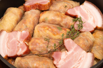 Romanian traditional food – Sarmale. Raw stuffed cabbage rolls with meat and rice in a pan ready for boiling  