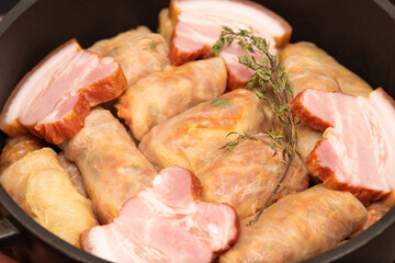 Romanian traditional food – Sarmale. Raw stuffed cabbage rolls with meat and rice in a pan ready for boiling  