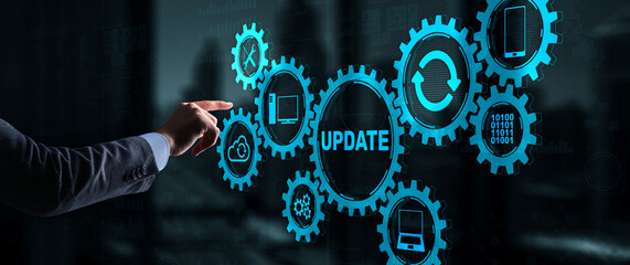 Businessman is pressing on the virtual screen Update Software Computer