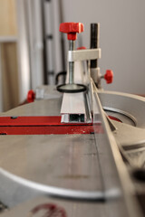 Detail of the mosquito net profile on the miter saw. Selective focus. Copy space