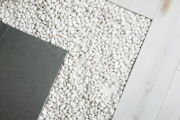Texture, background, pattern. Combination of white stone and gray tiles