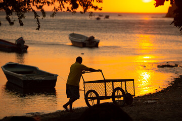 silhouette of a fisherman by the sea