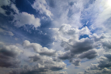 Beautiful clouds in the blue sky illuminated by the sun