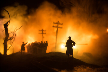 War Concept. Military silhouettes fighting scene on war fog sky background, World War Soldiers...