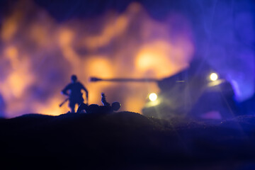 Obraz na płótnie Canvas War Concept. Military silhouettes fighting scene on war fog sky background, World War Soldiers Silhouette Below Cloudy Skyline At night. Battle in ruined city. Selective focus