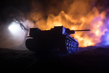 War Concept. Military silhouettes fighting scene on war fog sky background, World War Soldiers Silhouette Below Cloudy Skyline At night. Battle in ruined city. Selective focus