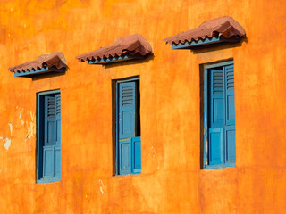 Fototapeta na wymiar view of three colorful windows in Cartagena de Indias, Colombia