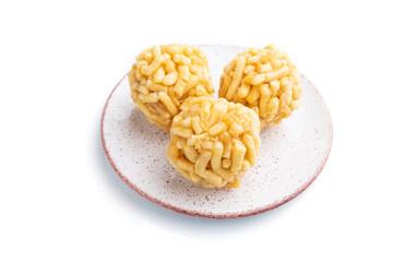 Traditional Tatar candy chak-chak made of dough and honey isolated on white background. Side view.