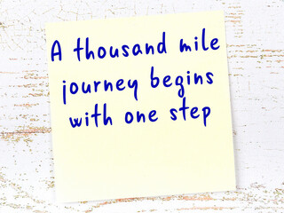 Yellow sticky note with handwritten motivational quote