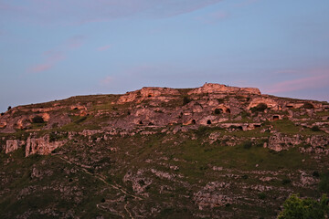 the beautiful stones of Matera and their caves at sunset