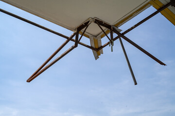 Old corrugate galvanized zinc sheet awning skeleton attached to the balcony. Abandoned house.