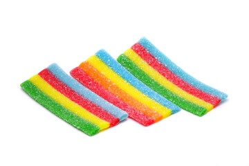 Fototapeta premium Rainbow chewy jelly isolated on white background. Colorful jelly candy. Unhealthy food, toxic kids food