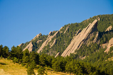Fototapeta na wymiar Flatirons and Chataqua Park meadow in Boulder, Colorado in the Summertime