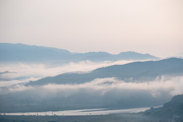 Surreal landscape of morning foggy..Morning clouds at sunrise.Landscape of fog and mountains of northern Thailand.
