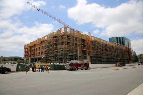 Employee Accident On Construction Site Work. Emergency Service. First Aid Procedure. Industrial Accident Requires Medical Attention From Paramedics And Fire Department. Emergency Response.