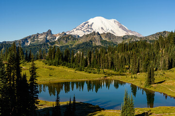 Summer fades at Tipsoo Lake as the volcanic peak of Mount Rainier dominates the horizon in the National Park south of Seattle