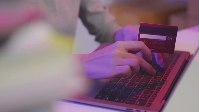 Woman using laptop and credit card with paying for shopping online.