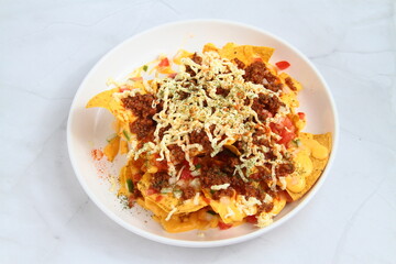 Freshly made nachos with ground beef and cheese